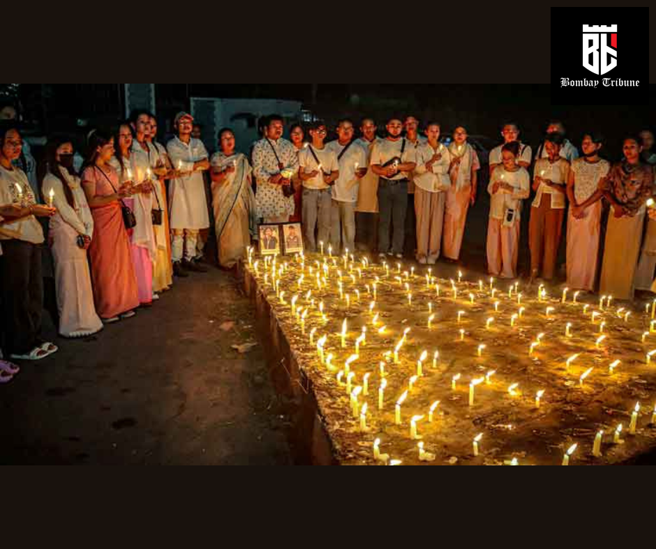 Women take part in a candlelight vigil in Imphal